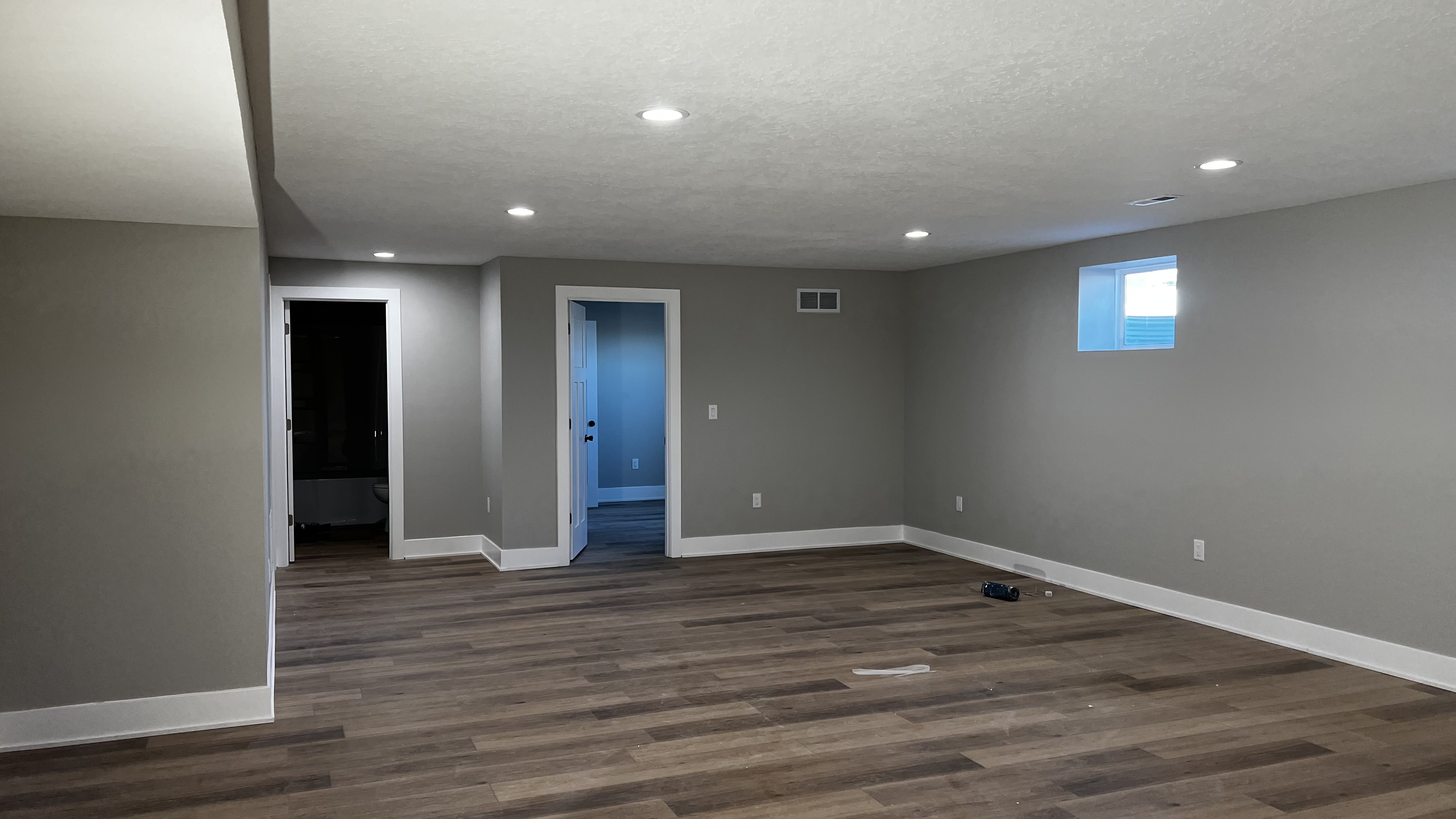 Finished basement with new flooring and trim